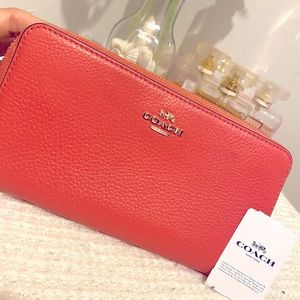 Coach New York bright coral wine clutch